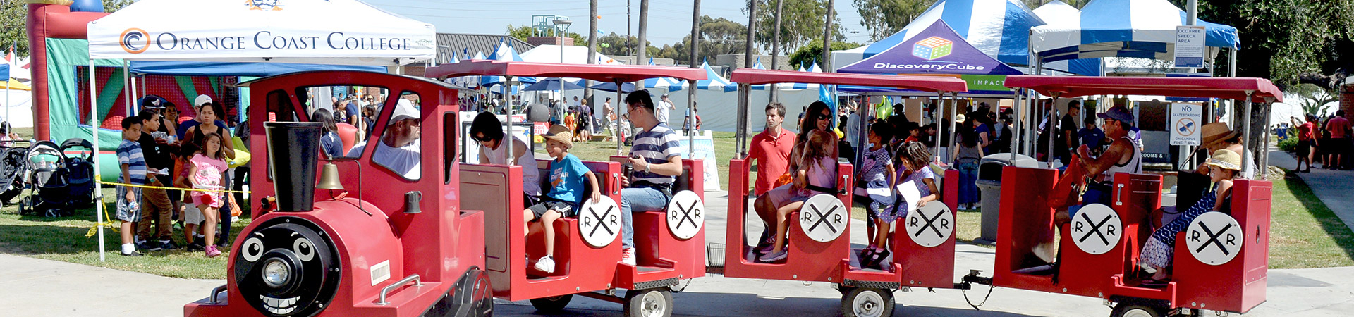 OC Book Festival at OCC: Parents and kids riding on trackless train