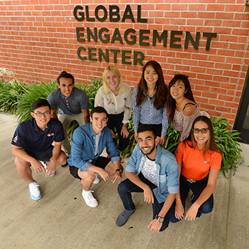 Group of student posing in front of Global Engagement Center